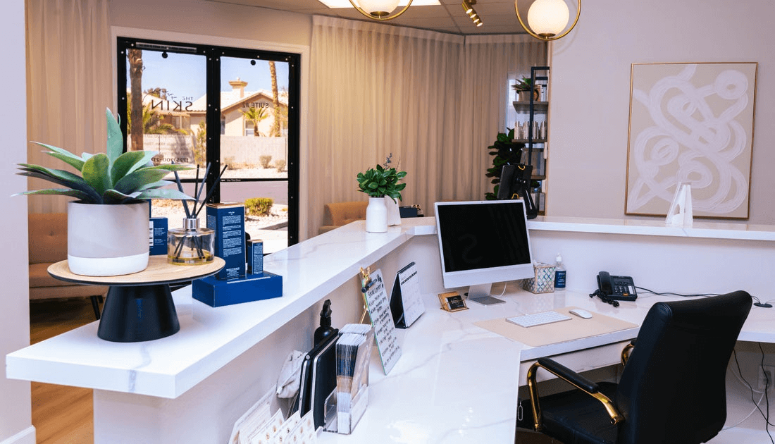 Behind the front desk of a medspa.